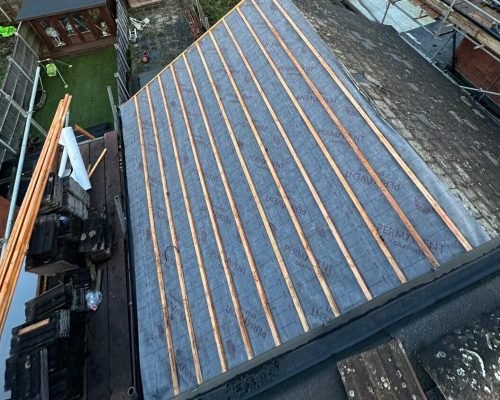 Elite Roofing team at work on a roof installation